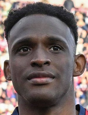 Люкуми, Джон